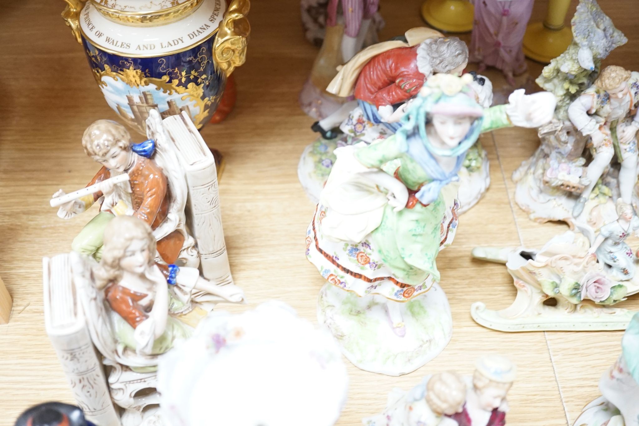 A collection of German and French porcelain figurines, Coalport commemorative urn etc.
